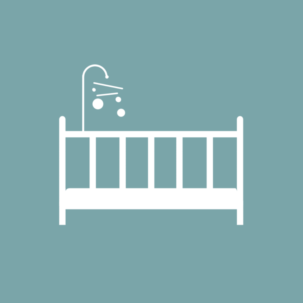Picture of a child's bed with mobile
